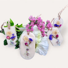 Load image into Gallery viewer, Blooming Flowers Sachets by Pure Essence Scent-white scented wax decorated with dried botanicals and pebbles for decoration, and twine loop for hanging.