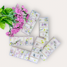 Load image into Gallery viewer, Strawberry Punch Wax Melts by Pure Essence Scent—white scented wax decorated with dried botanicals and decorative pebbles.