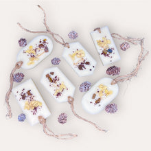 Load image into Gallery viewer, Cozy Nights Sachets by Pure Essence Scent-white scented wax decorated with ground coffee and pebbles for decoration, and twine loop for hanging.