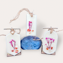 Load image into Gallery viewer, Pomegranade Sachets by Pure Essence Scent-white scented wax decorated with dried botanicals and pebbles for decoration, and twine loop for hanging.