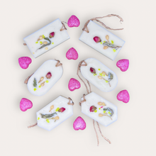 Load image into Gallery viewer, Strawberry Punch Sachets by Pure Essence Scent-white scented wax decorated with dried botanicals and pebbles for decoration, and twine loop for hanging.