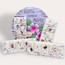 Load image into Gallery viewer, Cozy Nights Wax Melts by Pure Essence Scent—white scented wax decorated with ground coffee and decorative pebbles.