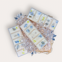 Load image into Gallery viewer, Mango Ciruela Wax Melts by Pure Essence Scent—white scented wax decorated with dried botanicals and decorative pebbles.