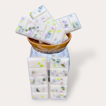 Load image into Gallery viewer, Strawberry Punch Wax Melts by Pure Essence Scent—white scented wax decorated with dried botanicals and decorative pebbles.