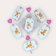 Load image into Gallery viewer, Pleasant Sunshine Sachets by Pure Essence Scent-white scented wax decorated with dried botanicals and pebbles for decoration, and twine loop for hanging.