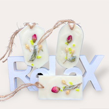 Load image into Gallery viewer, Strawberry Punch Sachets by Pure Essence Scent-white scented wax decorated with dried botanicals and pebbles for decoration, and twine loop for hanging.