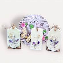 Load image into Gallery viewer, Summer Fields Sachets by Pure Essence Scent-white scented wax decorated with dried botanicals and pebbles for decoration, and twine loop for hanging.