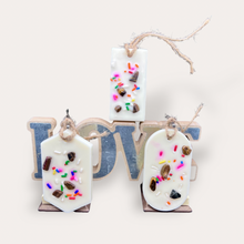 Load image into Gallery viewer, Cozy Nights Sachets by Pure Essence Scent-white scented wax decorated with colorful sprinkles and pebbles for decoration, and twine loop for hanging.