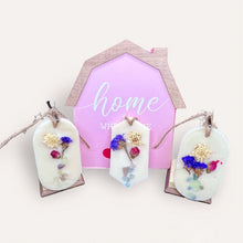 Load image into Gallery viewer, Blooming Flowers Sachets by Pure Essence Scent-white scented wax decorated with dried botanicals and pebbles for decoration, and twine loop for hanging.