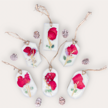 Load image into Gallery viewer, Lovely Garden Sachets by Pure Essence Scent-white scented wax decorated with dried botanicals and pebbles for decoration, and twine loop for hanging.