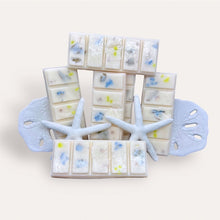 Load image into Gallery viewer, Mango Ciruela Wax Melts by Pure Essence Scent—white scented wax decorated with dried botanicals and decorative pebbles.