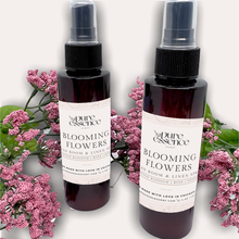 Load image into Gallery viewer, Blooming Flowers Room and Linen Spray by Pure Essence Scent-Amber plastic spray bottles filled with scented liquid.
