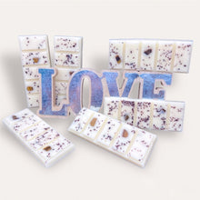 Load image into Gallery viewer, Cozy Nights Wax Melts by Pure Essence Scent—white scented wax decorated with ground coffee and decorative pebbles.