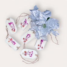 Load image into Gallery viewer, Pomegranade Sachets by Pure Essence Scent-white scented wax decorated with dried botanicals and pebbles for decoration, and twine loop for hanging.