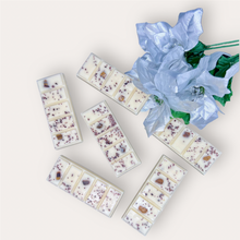 Load image into Gallery viewer, Cozy Nights Wax Melts by Pure Essence Scent—white scented wax decorated with ground coffee and decorative pebbles.