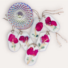 Load image into Gallery viewer, Lovely Garden Sachets by Pure Essence Scent-white scented wax decorated with dried botanicals and pebbles for decoration, and twine loop for hanging.