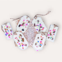 Load image into Gallery viewer, Cozy Nights Sachets by Pure Essence Scent-white scented wax decorated with colorful sprinkles and pebbles for decoration, and twine loop for hanging.