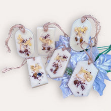 Load image into Gallery viewer, Cozy Nights Sachets by Pure Essence Scent-white scented wax decorated with ground coffee and pebbles for decoration, and twine loop for hanging.