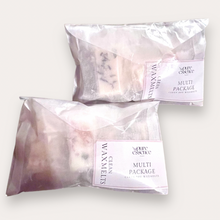 Load image into Gallery viewer, Two glassine bags of Multi Package Wax Melts by Pure Essence Scent-white labels, showing the product name and info like clean soy wax melts, with visible wax melts inside.
