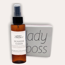 Load image into Gallery viewer, Seaside Oasis Room and Linen Spray by Pure Essence Scent-Amber plastic spray bottles filled with scented liquid.