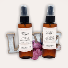 Load image into Gallery viewer, Lovely Garden Room and Linen Spray by Pure Essence Scent-Amber plastic spray bottles filled with scented liquid.